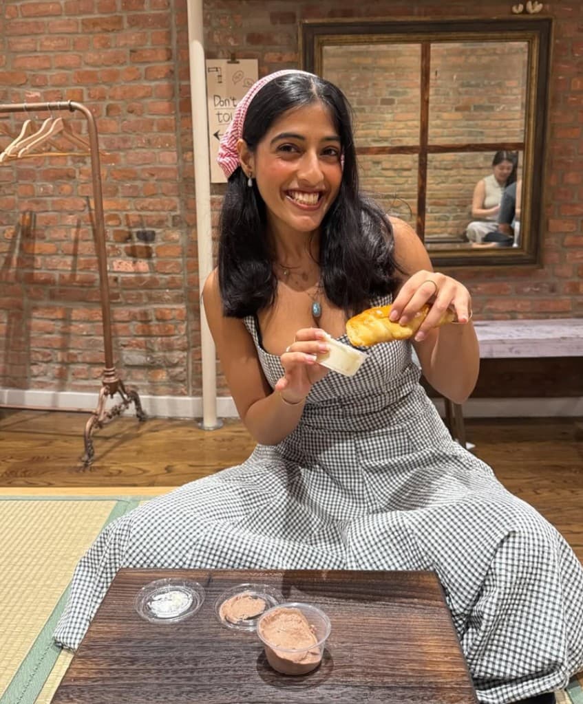 Chaitali with a city skyline and bridge